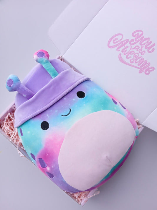 Squishmallow 12 inch pink, purple and blue smiling bug in a light pink kids gift box