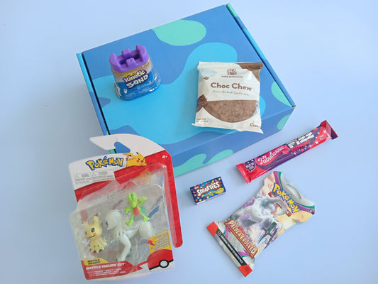 Pokemon kids gift box containing Pokemon Battle Figure Set, Pokemon Booster Pack, Choc Chew Cookie, Kinetic Sand, Smarties and Twister